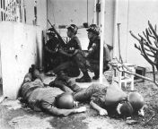 With dead US soldiers in the foreground, US military police officers take cover behind a wall at the entrance to the US Consulate in Saigon on January 31, 1968, the first day of the Tet Offensive. [640x403] from the fun version of the wear it big challenge