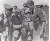 Fascist Italians holding the head of Ethiopia first general, Hailu Kebede, before they sent it to Rome for Mussolini to see it, 1937 [720491] from sirbaa haraa felmeta kebede