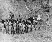 Naked Jewish women, some of whom are holding children, await their turn to be executed by Nazis from naked nigerian women