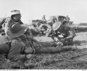 Korean War. Pakchon. 5 November 1950. A stretcher bearer attends to Corporal Don Parsons of C Company, 3rd Battalion, Royal Australian Regiment (3RAR). Corporal Parsons was wounded by a mortar shell that exploded about 30 yards away wounding him in the fo from chantelle parsons