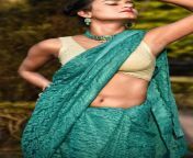 Tamanna Das navel in cream sleeveless blouse and green saree from kerala aunty strip green saree bl