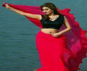 Roshni Kapoor navel in black sleeveless blouse and red saree from roshni ancut comamil