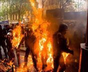 Riot police on fire after a Cocktail Molotov throw in Paris today from molotov samb