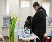 Parents mourn their baby killed in a shelling by Russian soldiers from by russian soldiers movie scene
