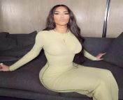 Kim kardashian showing off her stunning curves in a sexy dress from kim kardashian shows off her curves in a micro bikini 5