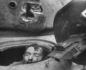Pfc. Julian H. Patrick lies dead in the driver&#39;s hatch of his M4A1 Sherman after it was knocked out during fighting in Cologne, Germany. March 6, 1945. from during fighting naked