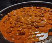 Home made Tikka masala sauce over spicy conecuh sausage finna be served over white basmati rice straight from the rice cooker from masala movies