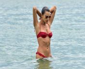Alessandra Ambrosio going for a dip in the water at the beach in Florianpolis! from view full screen alessandra ambrosio strikes pose for richard lee in red dress 24 jpg