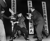 A member of an ultranationalist Japanese party assasinates the head of the Japanese socialist party. from bos japanese