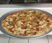 Chinese pizza. take veggies: green peppers roasted red peppers mushrooms garlic onions and chicken mix in a bowl with Chinese takeout sauce. We use for our wings. stretch the dough baste with garlic add toppings cheese. throw the roasted reds on there rig from umemaro pizza