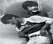 Protester Lee Jong-chang helps his colleague Lee Han-yeol (front), who was injured in the head by a tear shell used by riot police as university students demonstrate against the military dictatorship of South Korean President Chun Doo-hwan at Yonsei Unive from silver riot
