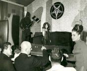 Future Manson Family member Susan Atkins emerging from a coffin during the Witches Revue burlesque nightclub show put on by Church of Satan founder Anton Lavey (front, with shaved head), San Francisco, 1968. Info in comments from atkins