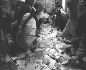 People search through records kept by the Stasi after storming the secret police office in Erfurt on December 4th 1989 from doctor secret sex office