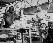 British sailor on the deck of HMS Sphinx removes schackles from a slave leg in Oman, 1907 from hot fucking numbir in oman