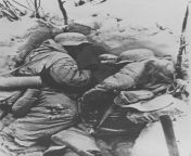 Two frost covered German soldiers lie dead from the cold or starvation in a foxhole in the outskirts of Stalingrad. Photo taken by Russian soldiers who overran these positions. Winter 1943 from by russian soldiers movie scene