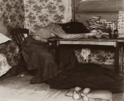 A young Mother, exhausted from spending hours making matchboxes, a pile of which can be seen on the table. At her feet is a young, sleeping baby covered by a blanket. Picture taken In Whitechapel, London circa 1890. from beautiful amp young mother breastfeeding