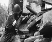 Posting Polish military stuff on a semi-regular basis until I forget I&#39;m doing it, day 169, A Polish insurgent with the rank of plutonowy, holding a sten gun at a barricade during the Warsaw Uprising, 1944 from rajetan falna sten