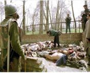 A journalist takes photo of 23 terrorists of JKLF(A) killed in a encounter in Srinagar, Kashmir, India. Shabbir Siddique, chief of JKLF (A) was also killed. They were killed on 29 March 1996 after they led a 3 day siege on Hazratbal mosque. This encounter from kavita kashmir