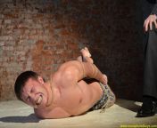 Prisoner flogged in hogtied position. A pic from RusCapturedBoys.com video Alexeys Unsuccessful Casting - Part I. from www xxx raep mp school com video 16
