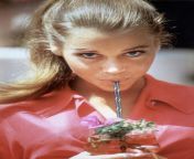 Young and beautiful Jane Fonda consuming the nutrients of a plant from jane fonda fakes