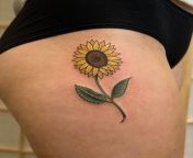 My first tattoo I named, A Simple Sunflower by Dan Bythewood at Ghost in the Machine Tattoo in Brighton MA, USA from ep70 feather birds tattoo timelapses