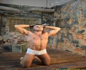 Prisoner stripped down to underwear, kneel down and shackled. Now he is ready for the forced physical training. A pic from RusCapturedBoys.com Series “Prisoner Armen. Part I”. from پاکستان پنجابی سکسvideo tv porn shackled