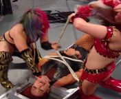 Asuka and Kairi Sane tying up Becky Lynch from sane lane