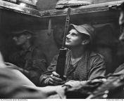 9 July 1968. Private Les Prendergast of 1RAR waits in an M113 APC before moving out on Operation Blue Mountains. The operation was a five day sweep by Australians of the area north of the Long Hai Hills in south-east Phuoc Tuy Province. from sunnet operation
