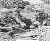 Vietnam War. 1971. WO2 Ramsay, Australian Army Training Team Vietnam (AATTV), advising on the techniques of capturing a prisoner during a training attack on a mock VC village at the Ranger Training Centre at Duc My, 300 miles north-east of Saigon. (428 xfrom vietnam