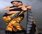 Priya Tiwari navel in black sleeveless blouse and yellow printed saree from priya tiwari fliz badmash