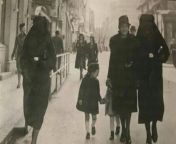 A Muslim woman covers the yellow star of her Jewish neighbour with her veil to protect her, Sarajevo, 1941. [599389] from sarajevo