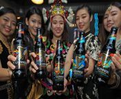 4 years ago today: Girls with multicultural traditional dress holding the three new reveal Malaysia limited-edition designs of Guinness Foreign Extra Stout in Kuala Lumpur. from video artis malaysia buat sexarrvdisex