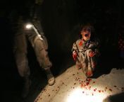 Samar Hassan, 5, screams after her parents were killed by US soldiers, 2005, Iraq. They fired on the family car when it approached them during a dusk patrol. Hussein and Camila were killed instantly. Racan, 11, was seriously wounded and paralyzed from the from racan