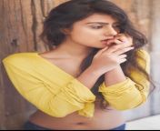 Twinkle Meena navel in yellow top and blue jeans from tam meena