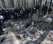 Journalists visiting a mass grave in Motyzhyn village, Kyiv Oblast from mass vidil nadu village oppan bathschool