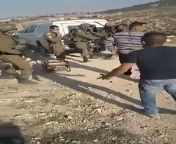 A Palestinian man in the West Bank - Harun Abu Aram - desperately tries to rescue his electric generator which Israeli soldiers had seized. So a soldier shoots him. Harun is now in critical condition. from israeli soldiers sex