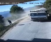 to overtake truck while man peeing on road side from road side peeing