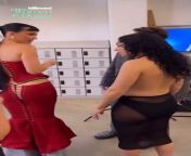 Interacting with Charli XCX at the Billboard Women In Music event, 2024 from karol g flaunts nice cleavage at the billboard women in music awards 10