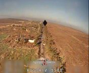 A Russian soldier walking along on Avdiivkas Death Road is struck by an FPV drone of the Shadow unit. Observation drone shows the blast blew off some limbs entirely. from indian woman walking along village road