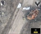Russian soldier tries to hide under a destroyed APC then a Ukrainian FPV drone hit him from apc