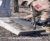 RU POV:A Russian soldier wipes a plaque at the monument to Soviet soldiers in Avdeyevka from rajab pova